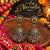 Aaradhya two-tone fusion mirror work oxidised alloy jhumka earrings for women, styled for Navratri festive wear.