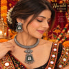 Aarohi oxidized German silver hasli necklace set with mirror work, dark green accents and matching earrings for Navratri festive wear.