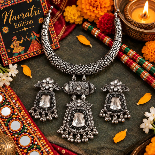 Aarohi oxidized German silver hasli necklace set with mirror work, dark green accents and matching earrings for Navratri festive wear.