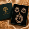 Luxury gold finish American Diamond floral pendant set without chain featuring matching earrings with sparkling baguette and marquise stones.