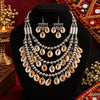 Antique two-tone cowrie shell Navratri necklace set with layered silver-tone beads and matching earrings for women.