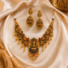 Antique Lakshmi temple jewelry necklace set with traditional jhumka earrings, ruby and emerald stones, and pearl danglings in South Indian bridal style