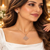 Rose gold Premium Brass pendant set with a diamond-shaped zirconia pendant and matching geometric stud earrings.