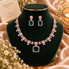 Rose gold Cubic Zirconia necklace set with matching dangling earrings, featuring a linked necklace design, sparkling rectangular centre stones and an elegant statement pendant.