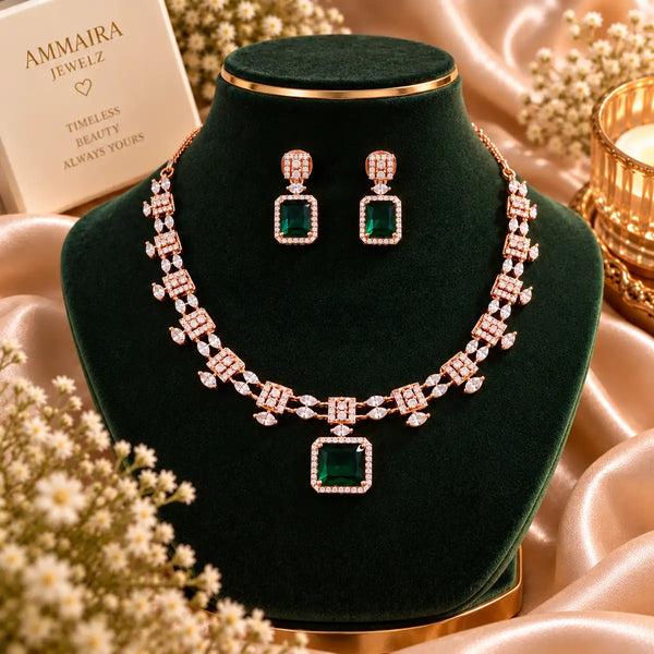 Rose gold Cubic Zirconia necklace set with matching dangling earrings, featuring a linked necklace design, sparkling rectangular centre stones and an elegant statement pendant.