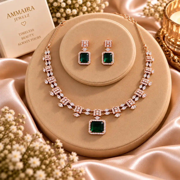 Rose gold Cubic Zirconia necklace set with matching dangling earrings, featuring a linked necklace design, sparkling rectangular centre stones and an elegant statement pendant.