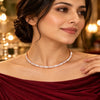 Rose gold Premium Brass hasli necklace featuring alternating rectangular baguette-style stones and sparkling zirconia accents.