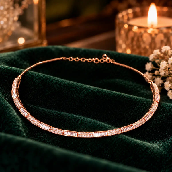 Rose gold Premium Brass hasli necklace featuring alternating rectangular baguette-style stones and sparkling zirconia accents.