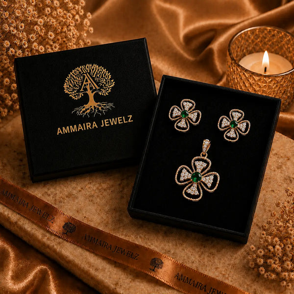 Rose gold Cubic Zirconia pendant set with matching floral-inspired earrings, green centre stones, sparkling clear CZ accents and elegant four-petal design by Ammaira Jewelz.