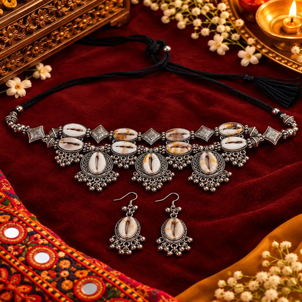 Cowrie shell oxidised necklace set with matching earrings and intricate silver detailing for women