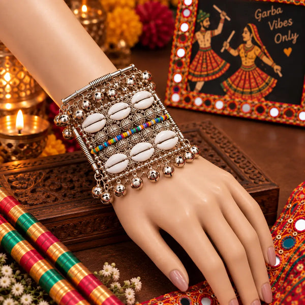 Broad antique silver oxidised alloy openable kada featuring cowrie shells, multicolor beads, and ghungroo charms.