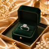 Elegant silver plated solitaire finger ring with a sparkling round crystal displayed in luxury jewelry boxes and worn by a stylish woman.