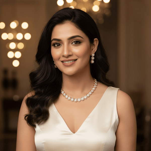 Rose gold necklace set with circular diamond-inspired motifs and matching drop earrings, displayed on a satin fabric background, showcasing elegant and minimal luxury jewellery design.