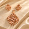 Rose gold American diamond pendant set in premium brass featuring a sparkling square grid design, layered stone borders and matching earrings.