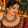 Handcrafted silver oxidised choker necklace set for women featuring layered floral motifs, matching earrings, and maangtikka.