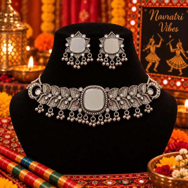Antique silver-tone oxidized mirrorwork statement choker necklace set for women with ghungroo drops and matching mirrorwork earrings.