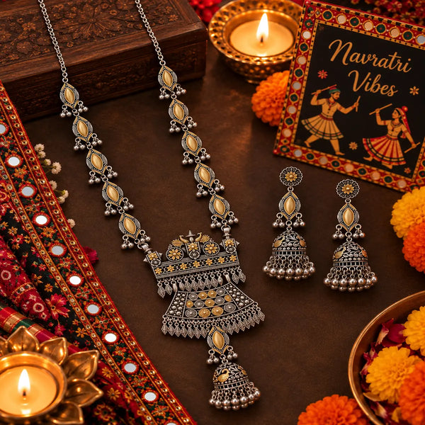 Statement two tone silver and gold oxidized necklace with peacock-inspired pendant, jhumka drop and matching long jhumka earrings for women.