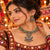 Peacock motif oxidised necklace set with colourful circular motifs, ornate silver detailing and matching earrings