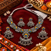 Peacock motif oxidised necklace set with colourful circular motifs, ornate silver detailing and matching earrings