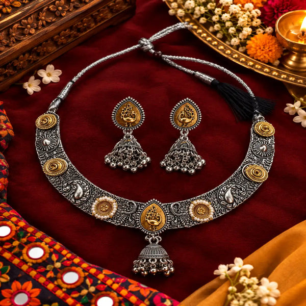 Peacock-inspired oxidised necklace set with ornate silver detailing, gold-tone accents and matching jhumka earrings