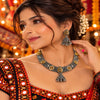 Peacock-inspired oxidised necklace set with ornate silver detailing, gold-tone accents and matching jhumka earrings