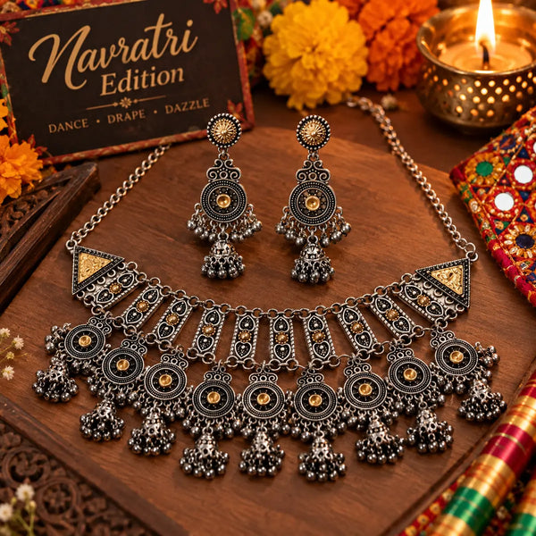 Royal German silver statement necklace set for women with antique silver and gold-tone detailing, intricate pendant and matching long jhumka earrings by Ammaira Jewelz.