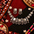 Rajvanshi antique oxidised ghungroo necklace set for women with traditional motifs and matching earrings.