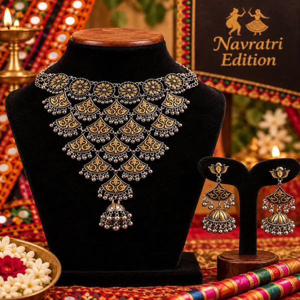 Statement two tone silver and gold choker necklace set with ghungroo details and matching long jhumka earrings for women.