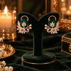 Rose gold floral statement earrings with oval centre stones, leaf motifs and sparkling zirconia detailing, available in ruby red, emerald green, blush pink and deep purple.