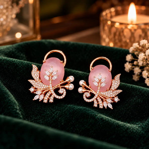 Rose gold floral statement earrings with oval centre stones, leaf motifs and sparkling zirconia detailing, available in ruby red, emerald green, blush pink and deep purple.