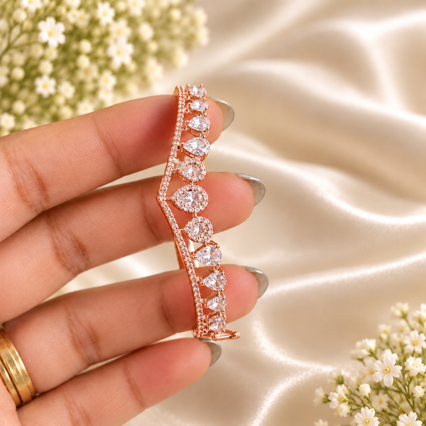 Rose gold premium brass bracelet featuring clear zirconia teardrop stones and delicate sparkling accents with 18K rose gold polish.