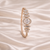 Rose gold bracelet with diamonds on a satin background