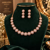 Rose gold Cubic Zirconia round link necklace set with matching three-tier round dangling earrings, featuring sparkling circular stone detailing.