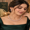 Rose gold Cubic Zirconia round link necklace set with matching three-tier round dangling earrings, featuring sparkling circular stone detailing.