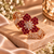 Rose gold premium brass floral cuff bracelet featuring red or purple zirconia petal clusters, clear marquise-shaped stones and sparkling detailing.