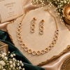 Rose gold Cubic Zirconia circular link necklace set with matching three-circle dangling earrings, featuring alternating sparkling and polished round links.