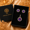 Royal Amethyst Halo American Diamond pendant set with rose gold polish and matching earrings featuring a round purple centre stone.