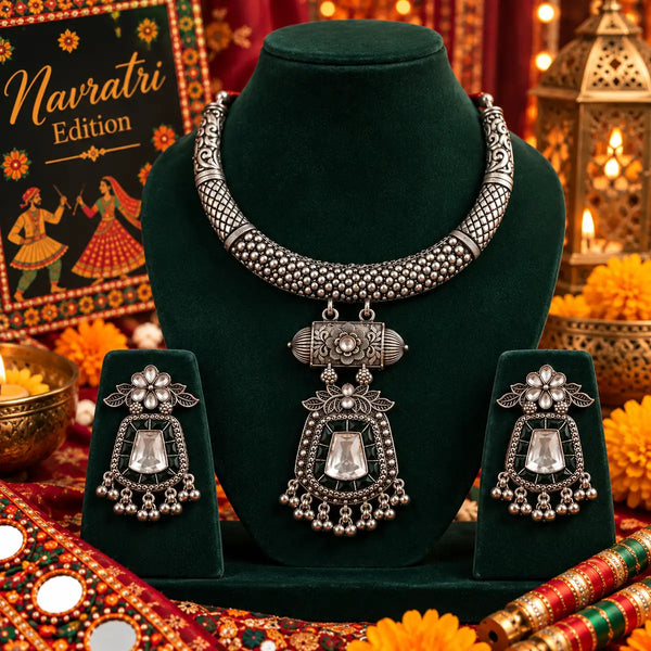 Aarohi oxidized German silver hasli necklace set with mirror work, dark green accents and matching earrings for Navratri festive wear.