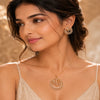 Luxury gold finish American Diamond floral pendant set without chain featuring matching earrings with sparkling baguette and marquise stones.
