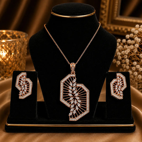 Rose gold Cubic Zirconia pendant set with matching geometric fan-inspired earrings, intricate openwork detailing and sparkling clear stones by Ammaira Jewelz.