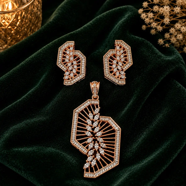 Rose gold Cubic Zirconia pendant set with matching geometric fan-inspired earrings, intricate openwork detailing and sparkling clear stones by Ammaira Jewelz.