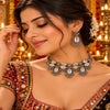 Cowrie shell oxidised necklace set with matching earrings and intricate silver detailing for women
