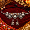 Cowrie shell oxidised necklace set with matching earrings and intricate silver detailing for women