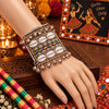 Broad antique silver oxidised alloy openable kada featuring cowrie shells, multicolor beads, and ghungroo charms.