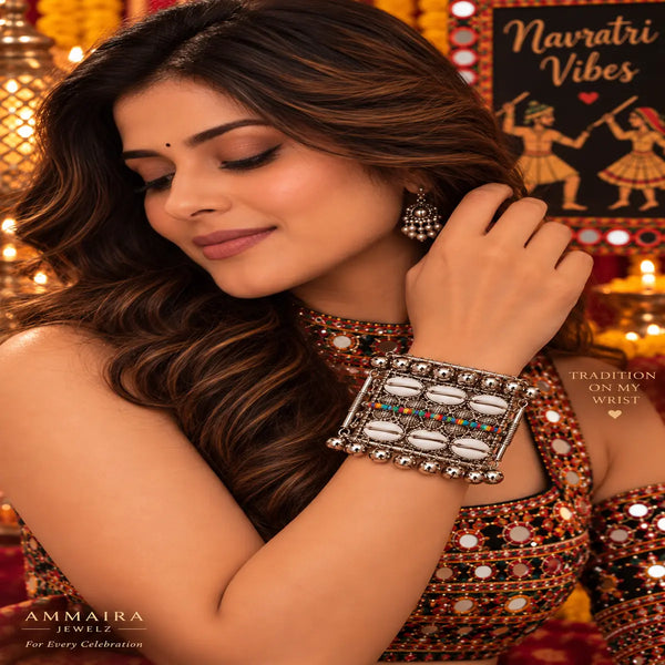 Broad antique silver oxidised alloy openable kada featuring cowrie shells, multicolor beads, and ghungroo charms.