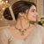 Divine Gajmukha Temple Matte Rose Gold Necklace Set with Ruby & Emerald Accents