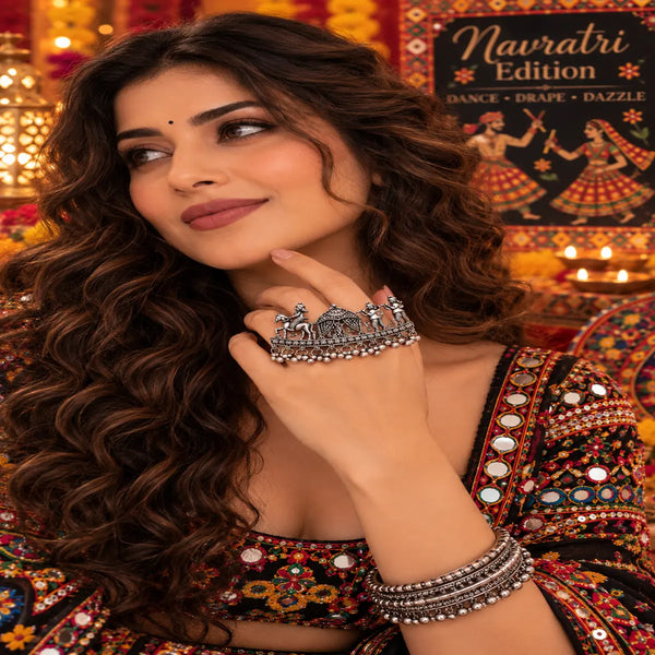 Doli Baraat Heritage alloy oxidized two-finger ring for women with traditional procession-inspired detailing and hanging bead accents