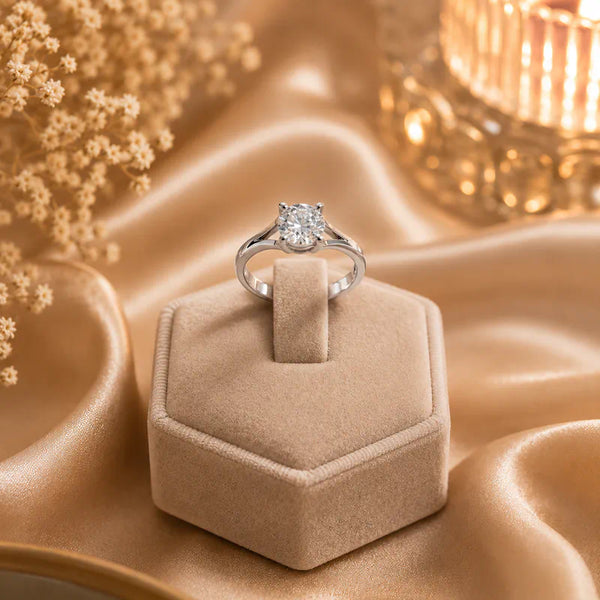 Elegant silver plated solitaire finger ring with a sparkling round crystal displayed in luxury jewelry boxes and worn by a stylish woman.
