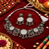 Elephant motif oxidised necklace set with circular decorative elements, intricate silver detailing and matching earrings