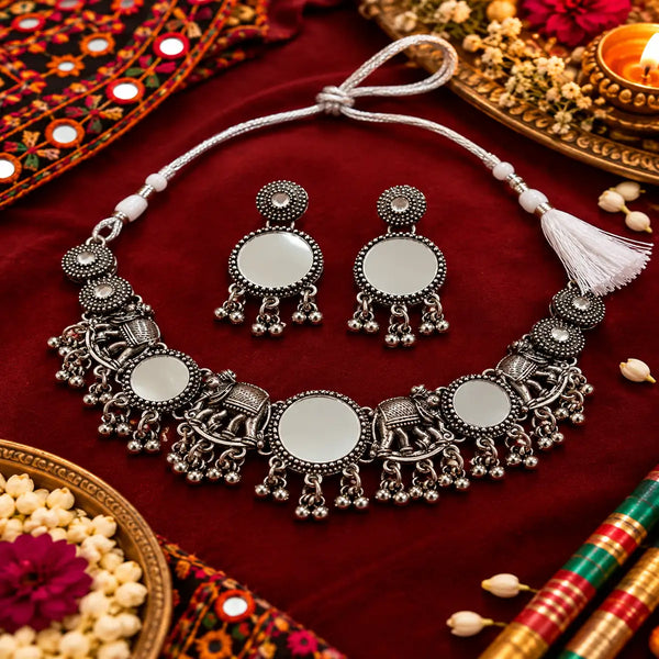 Elephant motif oxidised necklace set with circular decorative elements, intricate silver detailing and matching earrings